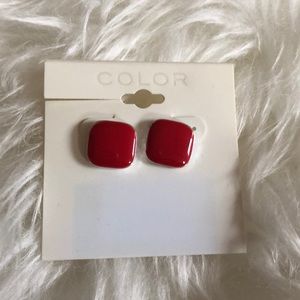 Red stud earrings.